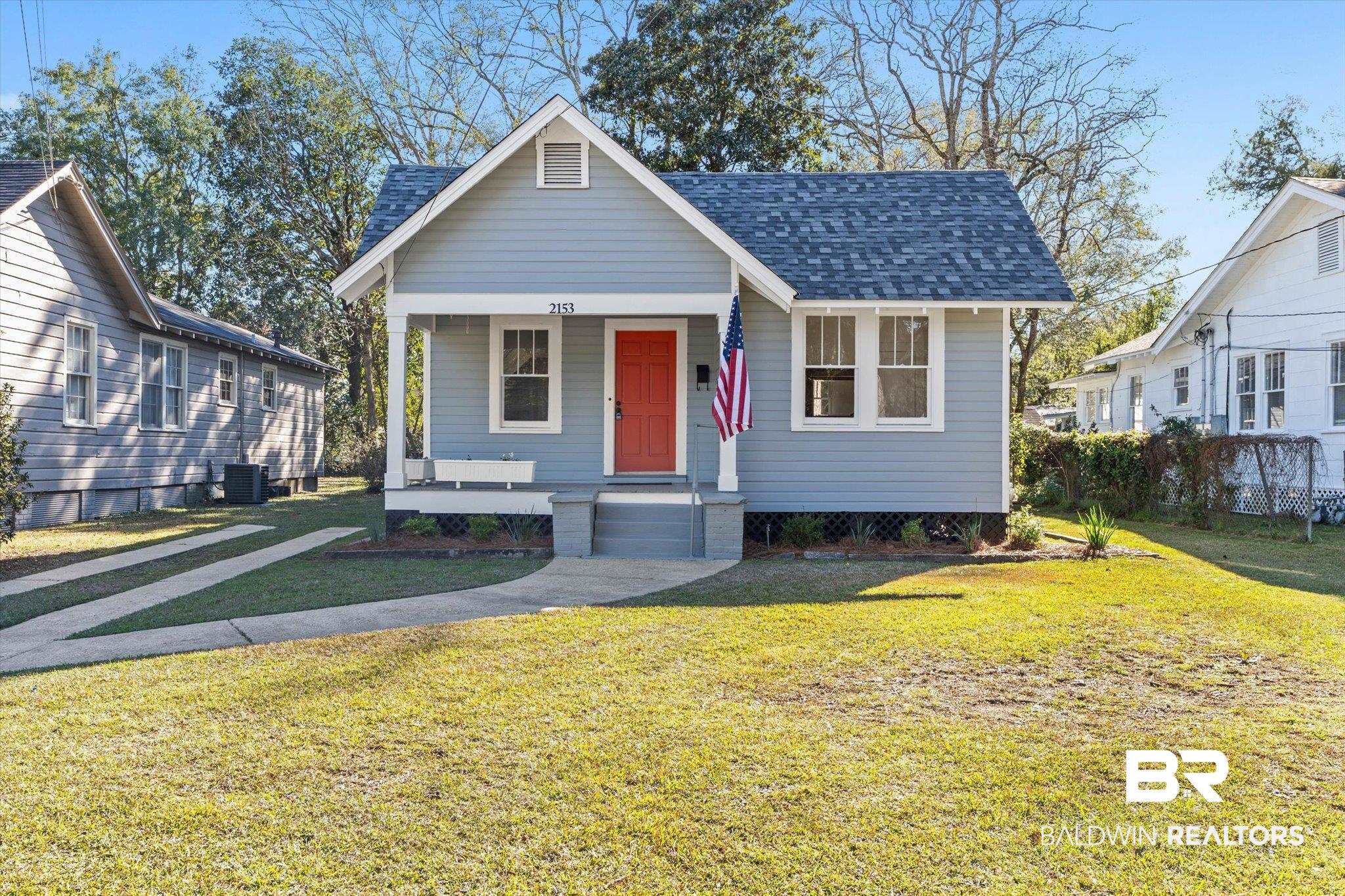 2153 Old Government Street Mobile, AL 36606 - Photo 21 of 23 View of front of property featuring a porch, a front lawn, and roof with shingles
