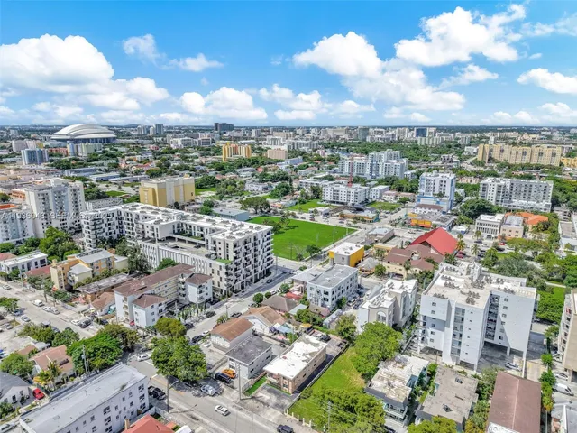 an aerial view of residential houses with city view