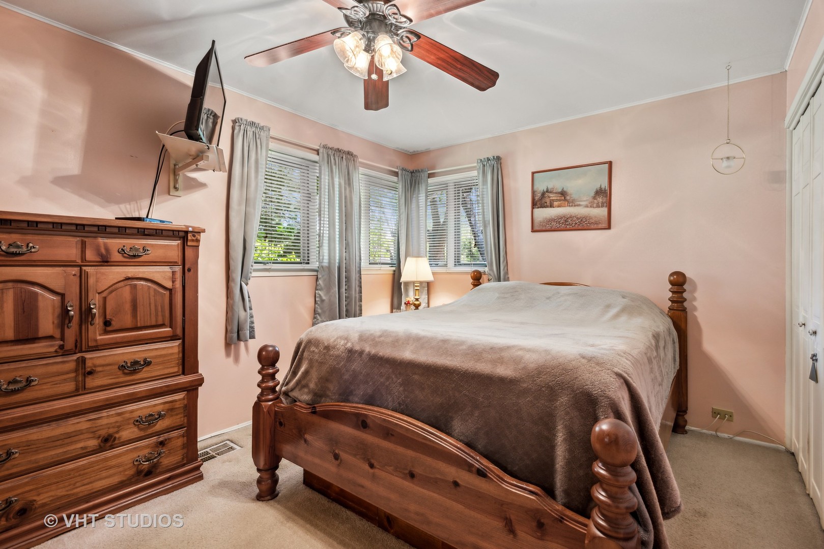 3607 Wren Lane Rolling Meadows, IL 60008 - Photo 12 of 23 a bedroom with a bed and a chandelier