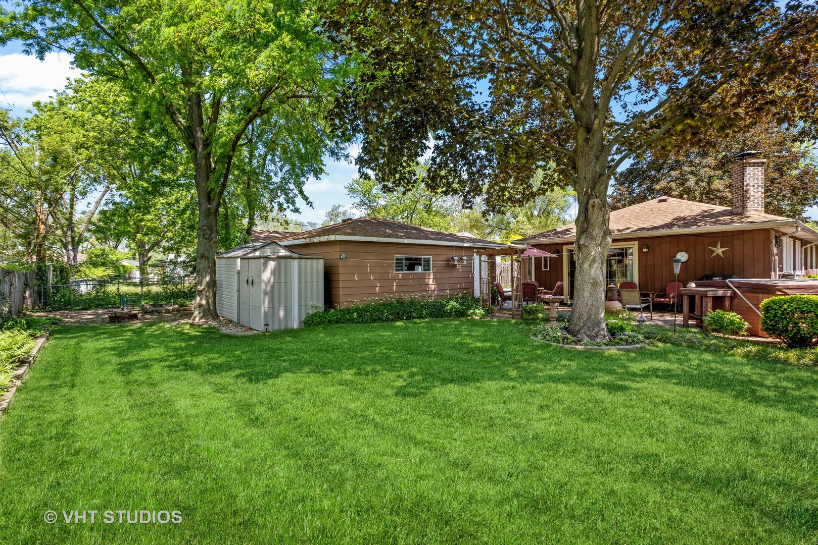 3607 Wren Lane Rolling Meadows, IL 60008 - Photo 21 of 23 a front view of a house with a garden