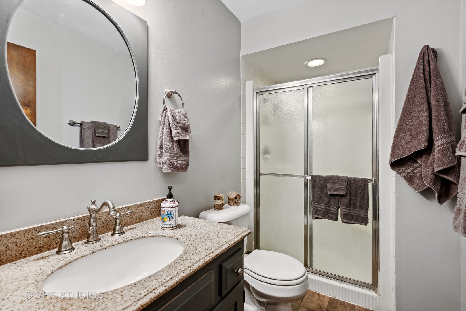 3607 Wren Lane Rolling Meadows, IL 60008 - Photo 7 of 23 a bathroom with a granite countertop sink toilet and shower