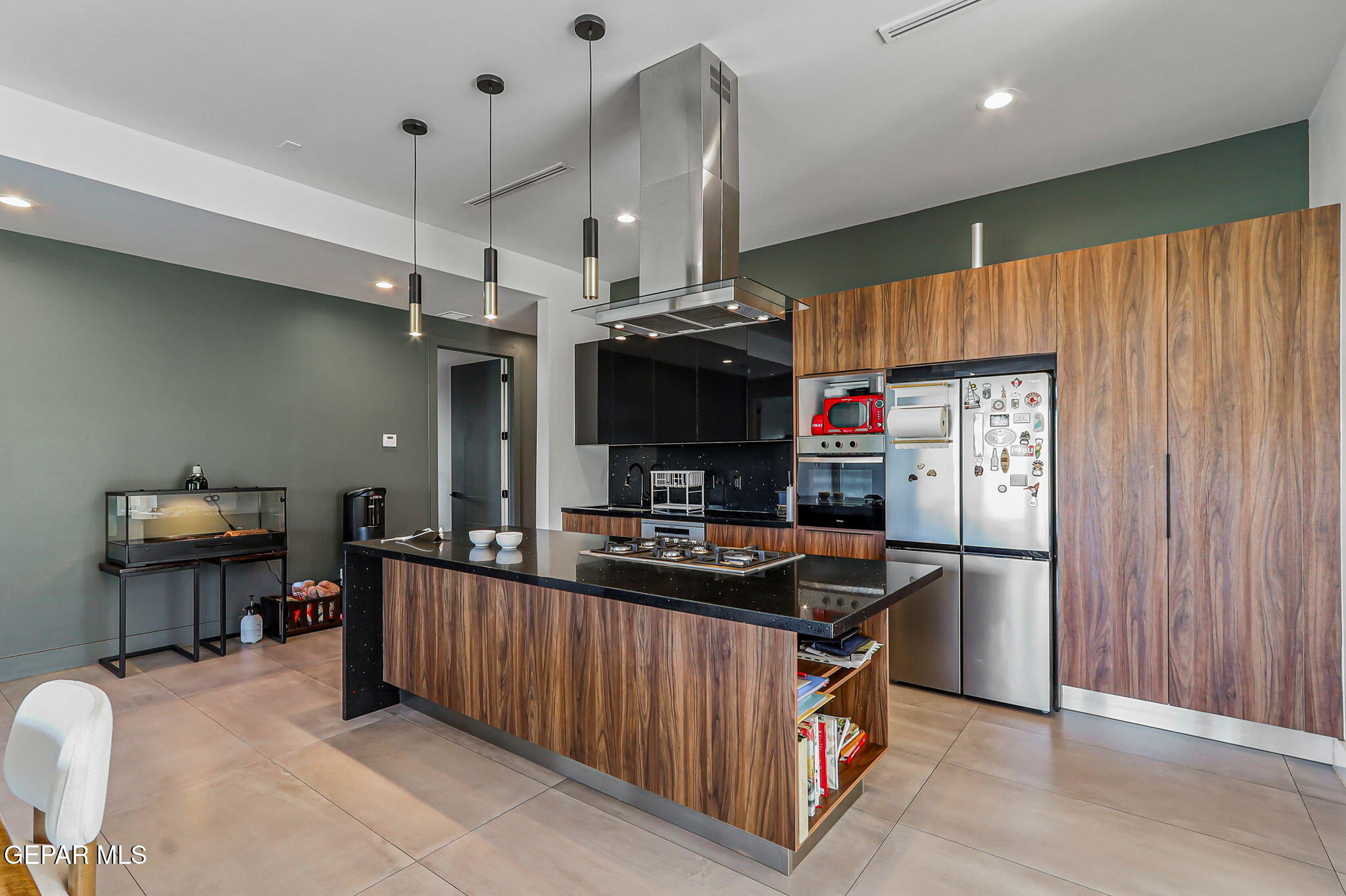 329 Rio Del Rancho Court El Paso, TX 79932 - Photo 12 of 52 a kitchen with kitchen island granite countertop a sink stove and refrigerator