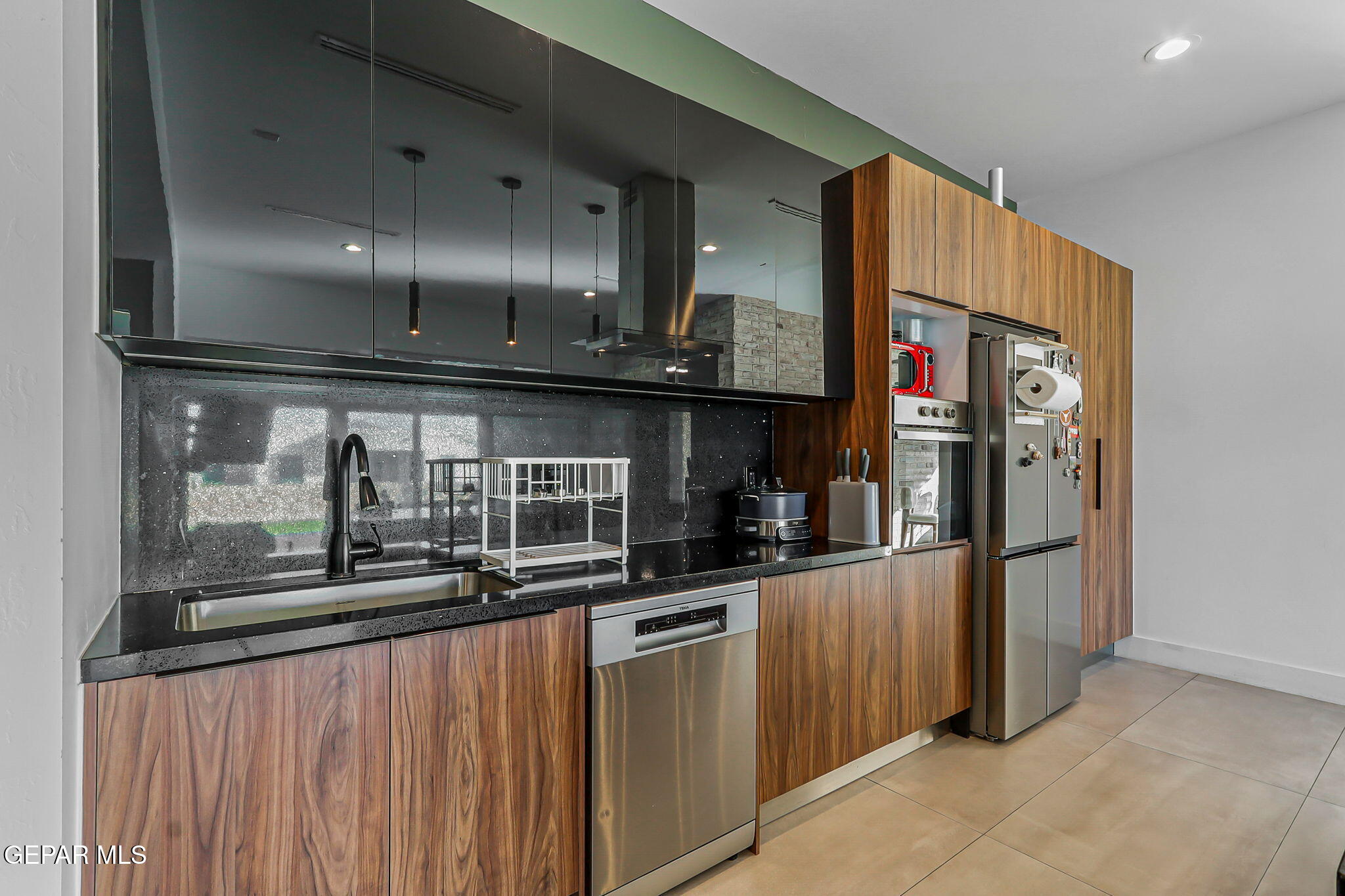329 Rio Del Rancho Court El Paso, TX 79932 - Photo 13 of 52 a kitchen with stainless steel appliances granite countertop a refrigerator and a stove