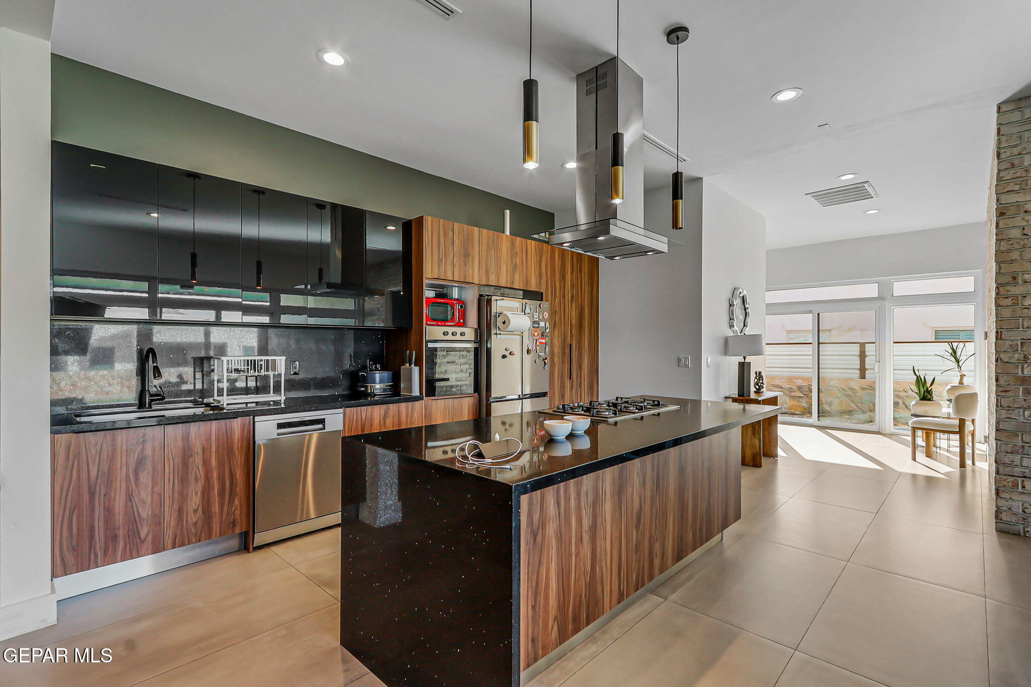 329 Rio Del Rancho Court El Paso, TX 79932 - Photo 14 of 52 a kitchen with stainless steel appliances granite countertop a stove and a refrigerator