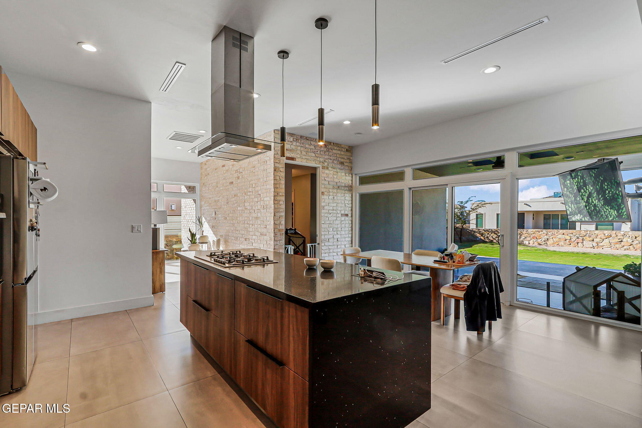 329 Rio Del Rancho Court El Paso, TX 79932 - Photo 17 of 52 a kitchen with stainless steel appliances granite countertop a sink stove and refrigerator