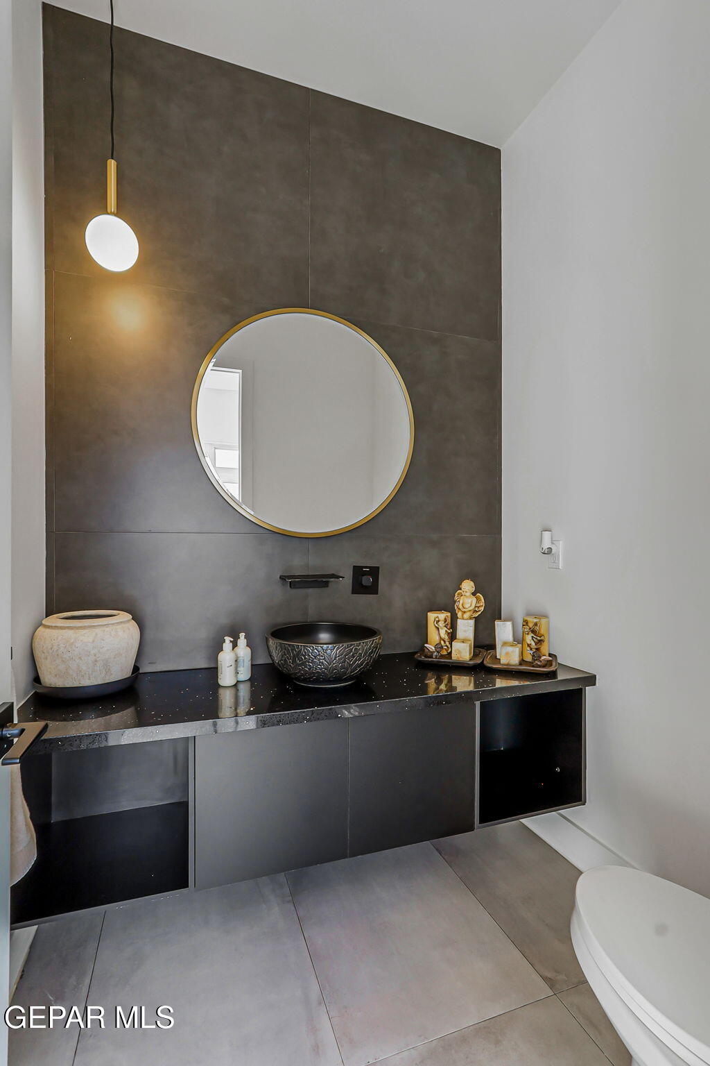 329 Rio Del Rancho Court El Paso, TX 79932 - Photo 22 of 52 a bathroom with a sink a toilet and mirror