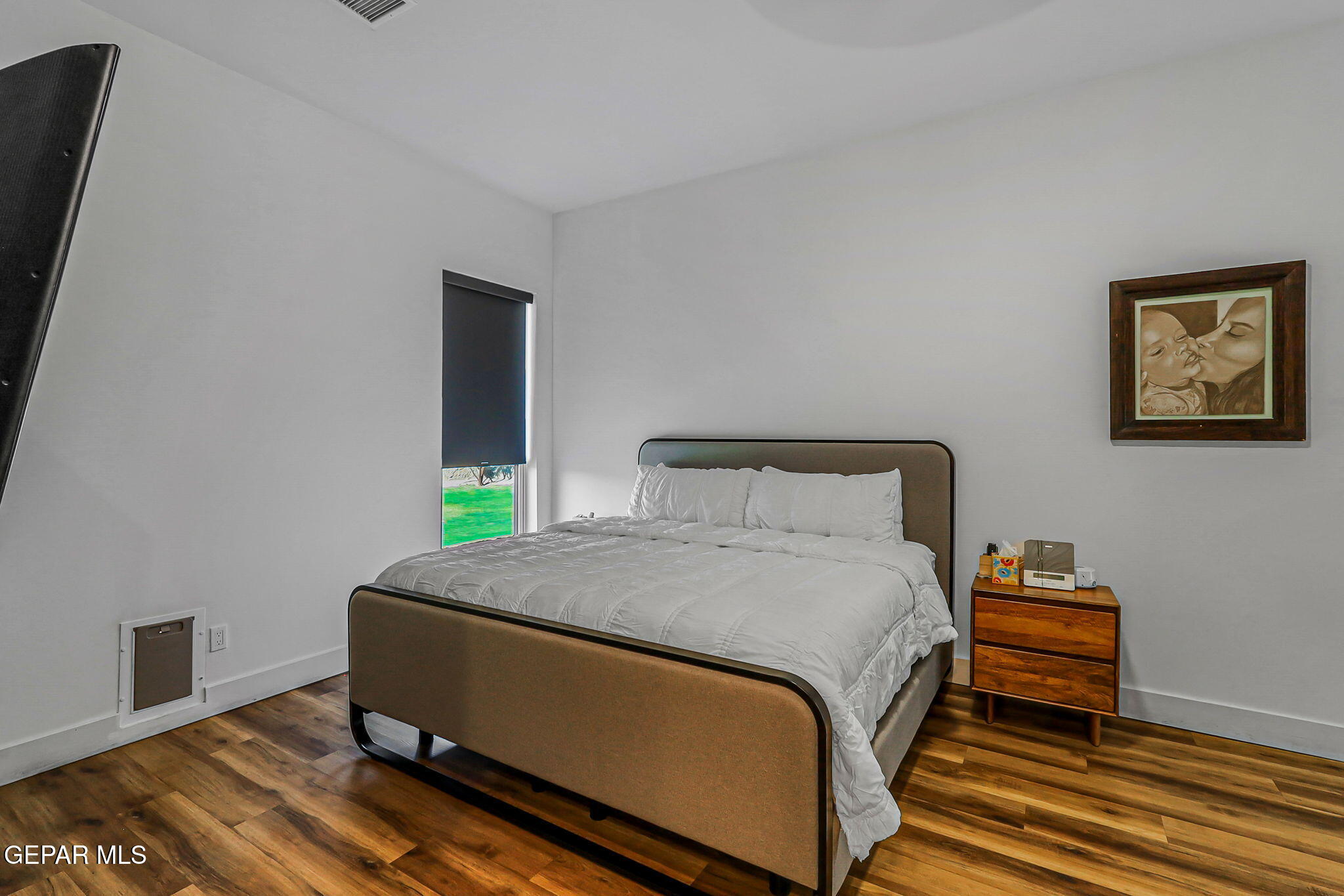 329 Rio Del Rancho Court El Paso, TX 79932 - Photo 24 of 52 a bed sitting in a bedroom next to a window