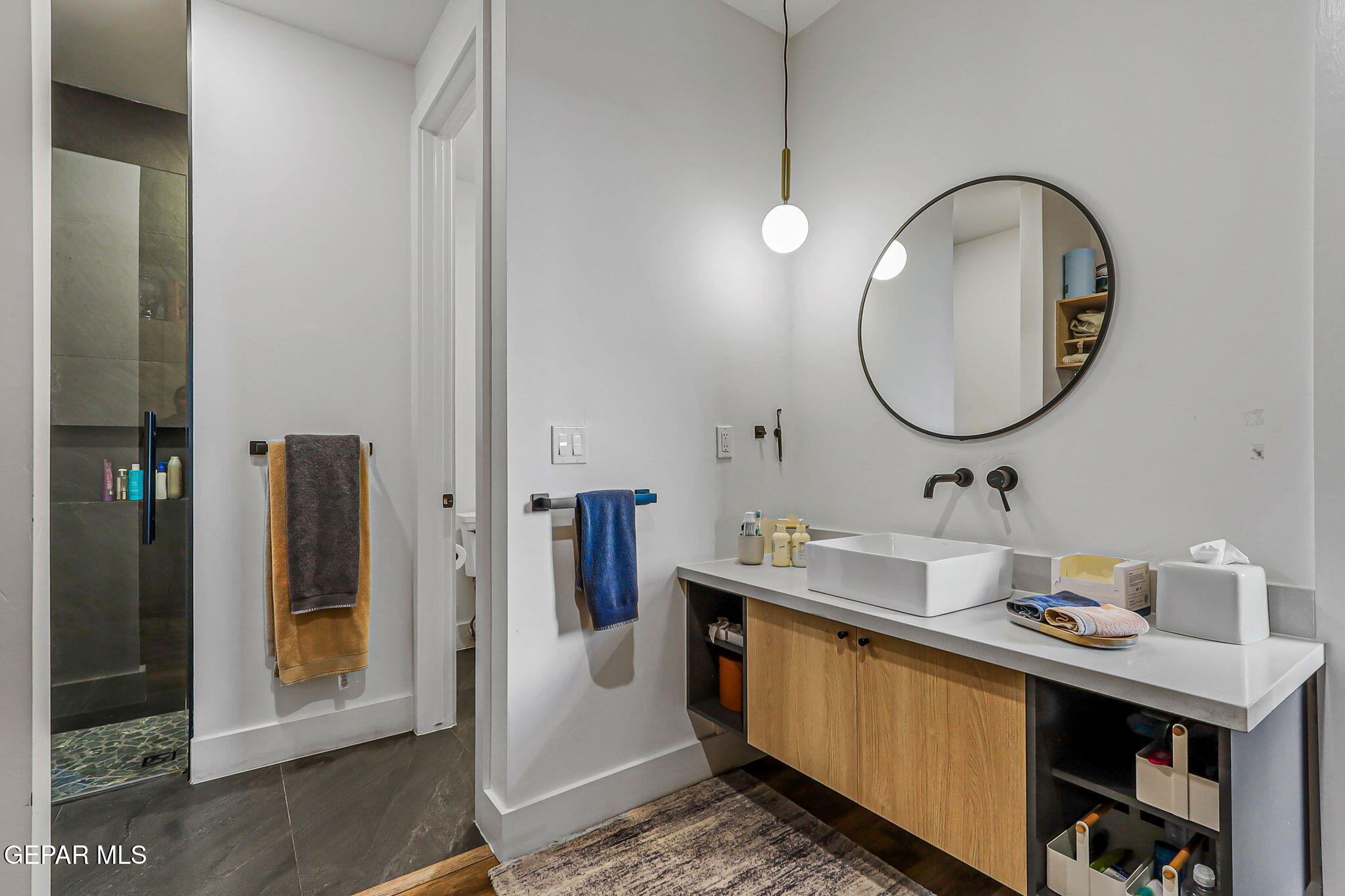 329 Rio Del Rancho Court El Paso, TX 79932 - Photo 37 of 52 a bathroom with a sink and a mirror
