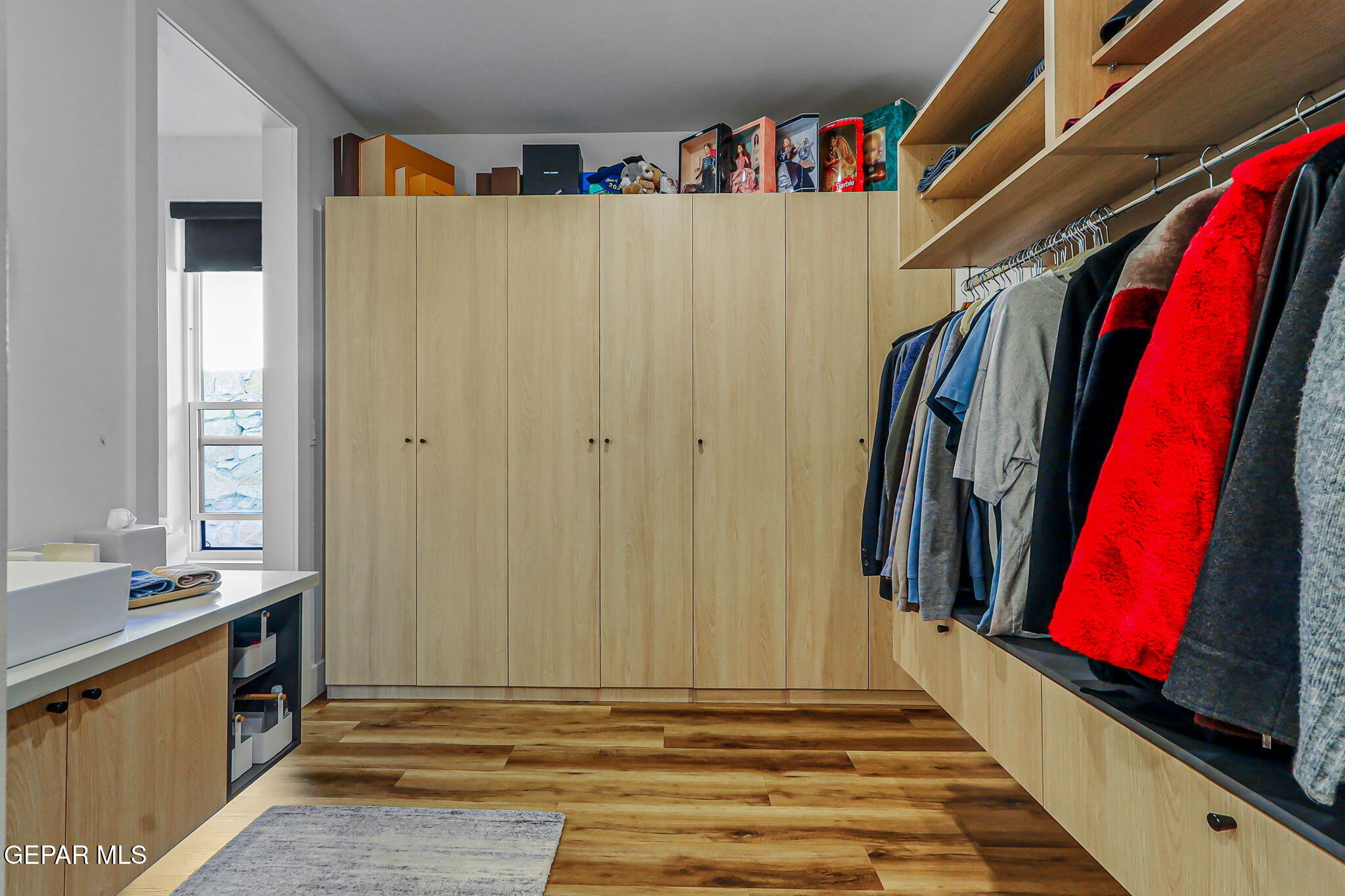329 Rio Del Rancho Court El Paso, TX 79932 - Photo 38 of 52 a view of a closet with clothes and shoes