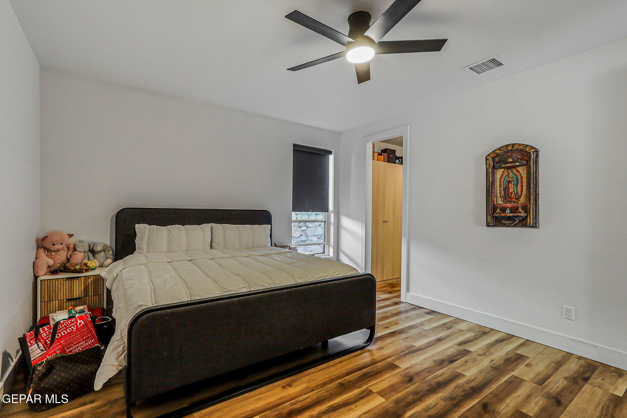 329 Rio Del Rancho Court El Paso, TX 79932 - Photo 42 of 52 a bedroom with a bed and a chandelier