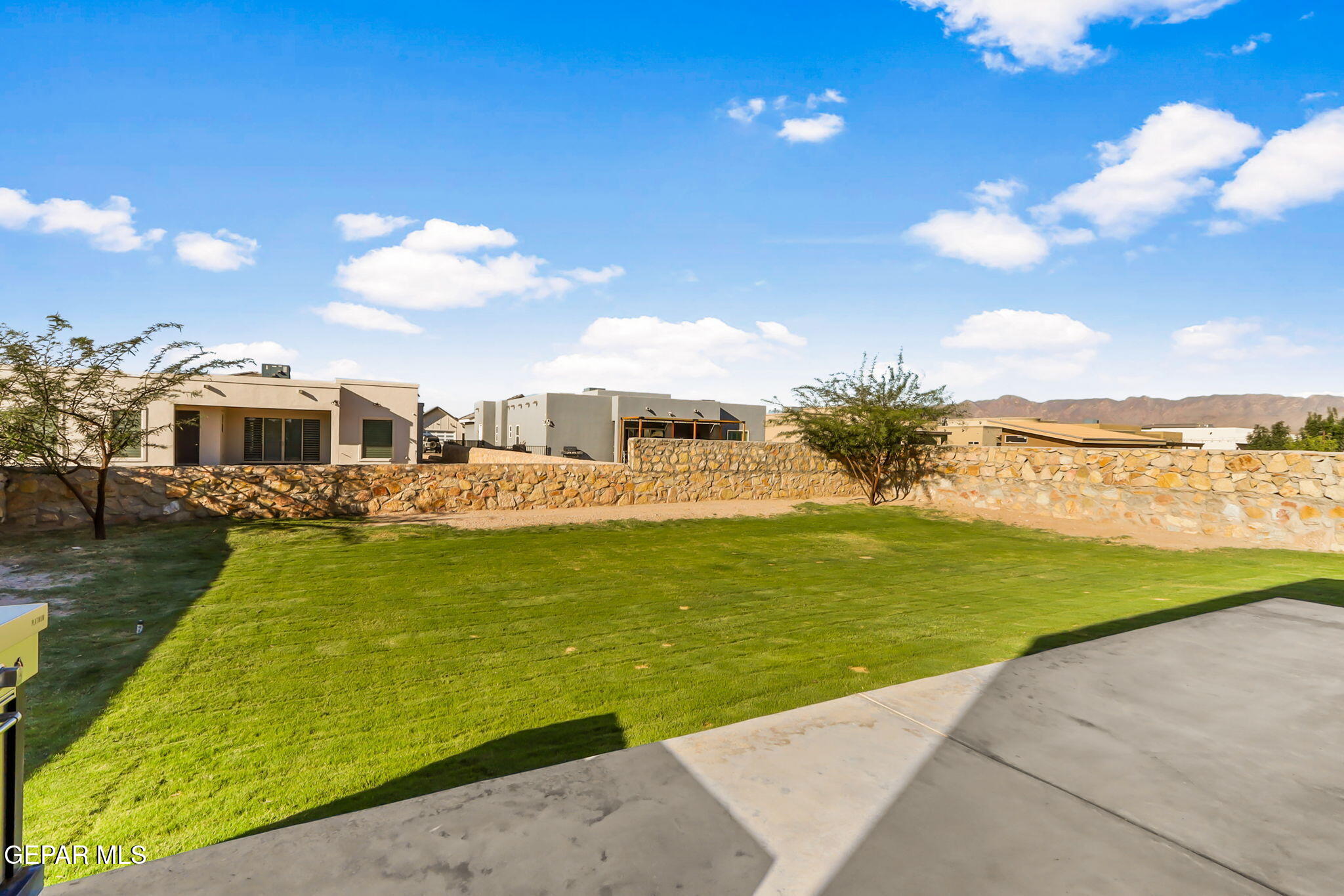 329 Rio Del Rancho Court El Paso, TX 79932 - Photo 48 of 52 a view of a swimming pool with an outdoor seating and a garden