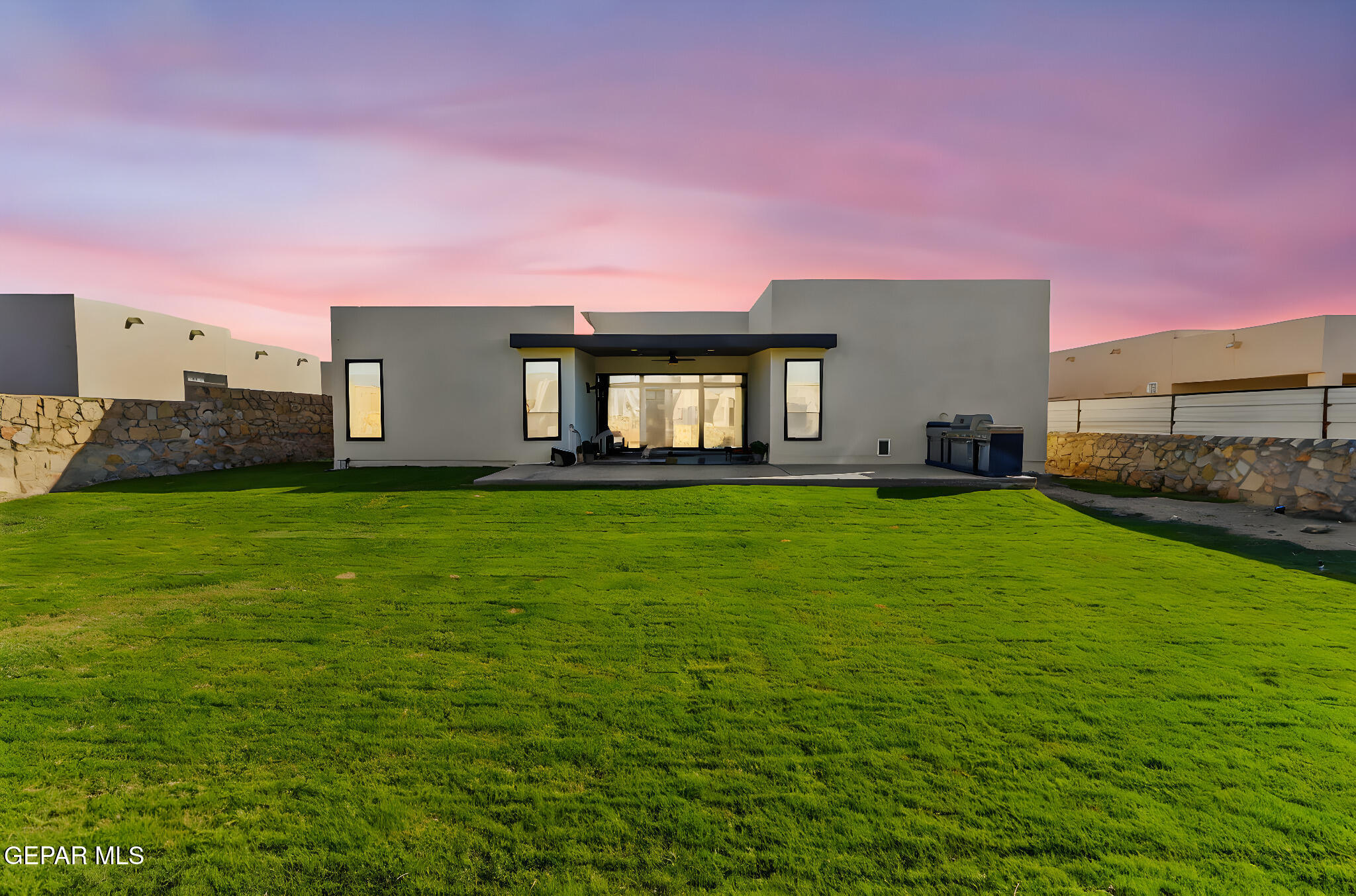 329 Rio Del Rancho Court El Paso, TX 79932 - Photo 51 of 52 a front view of a house with a yard and garage