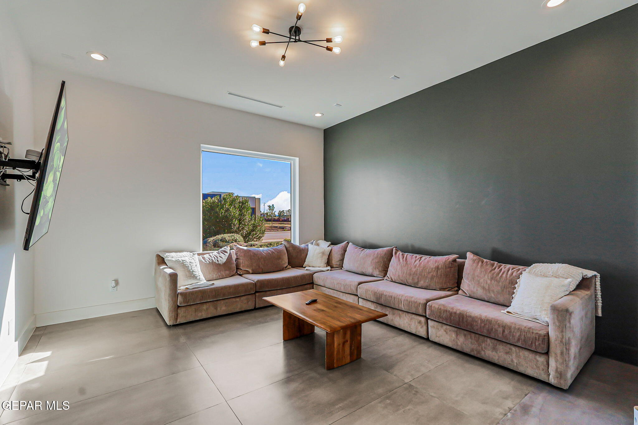 329 Rio Del Rancho Court El Paso, TX 79932 - Photo 9 of 52 a living room with furniture and a ceiling fan