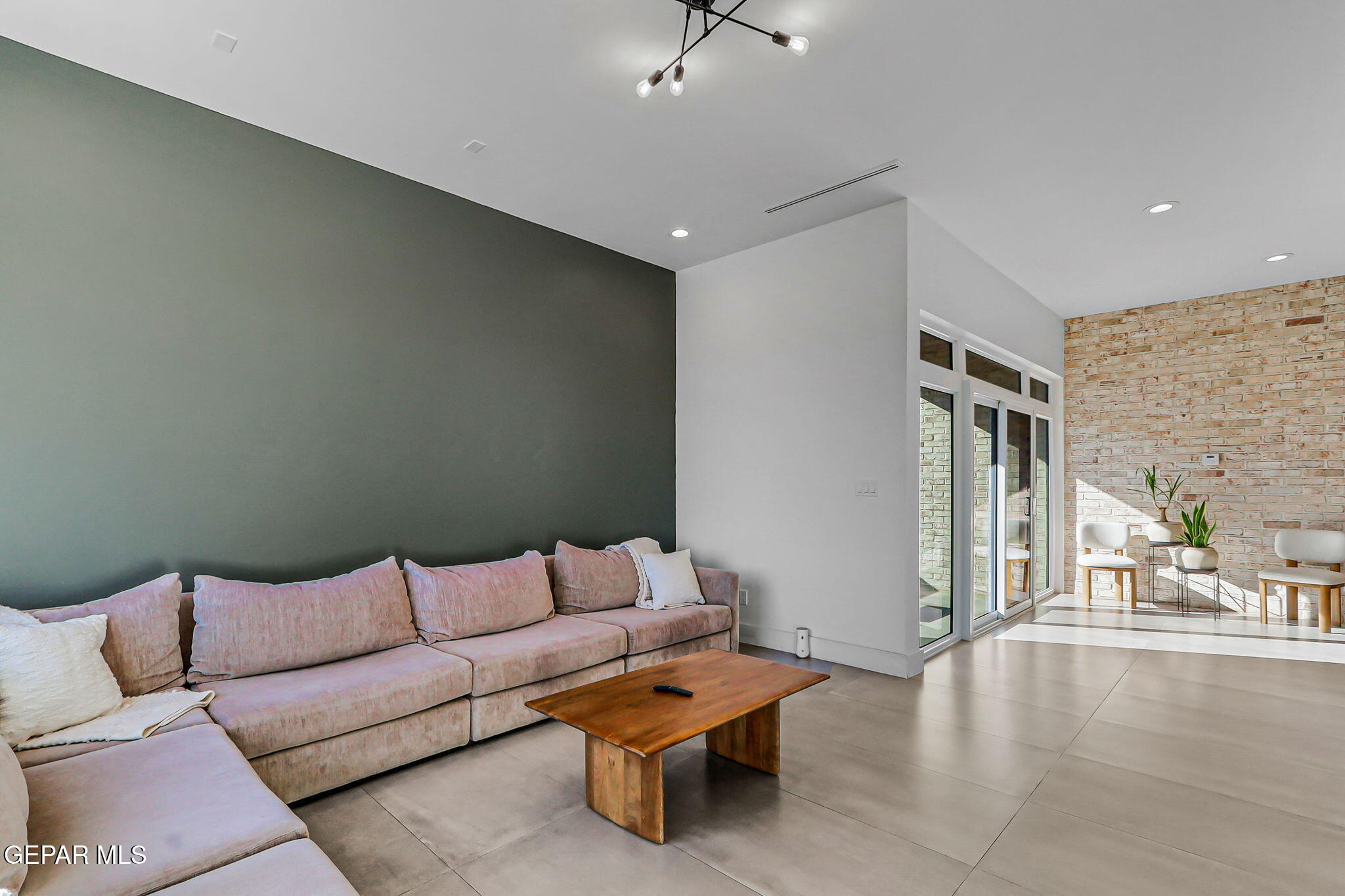 329 Rio Del Rancho Court El Paso, TX 79932 - Photo 10 of 52 a living room with furniture and a chandelier