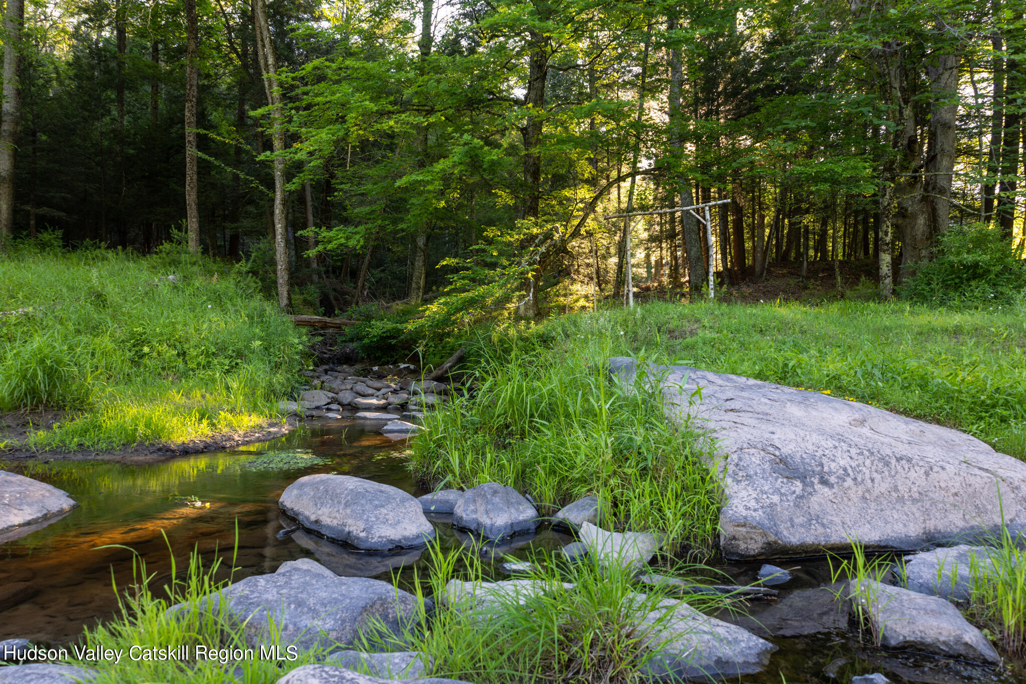 4049 Atwood Road, Unit END OF GERWIN ROAD Stone Ridge, NY 12484 - Photo 23 of 30 a view of a garden with lawn chairs and a fire pit