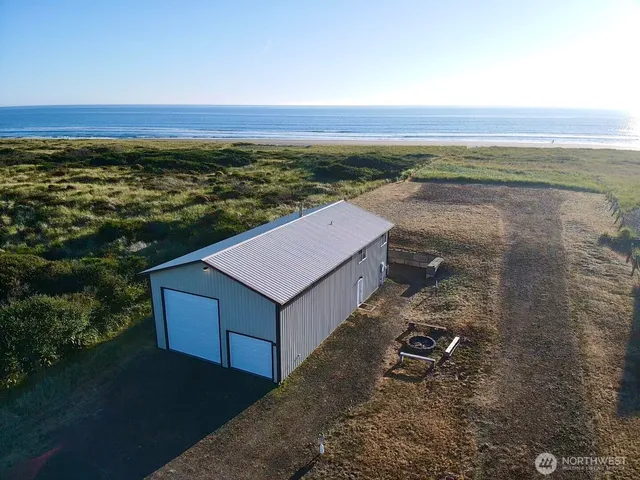 an aerial view of residential house and ocean