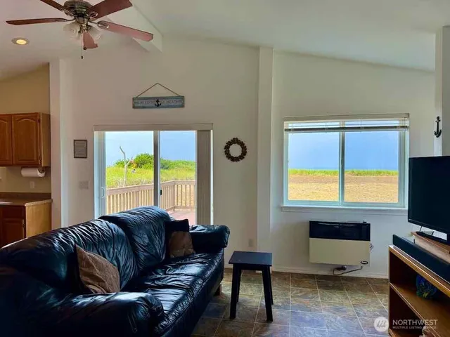 a living room with furniture and a window