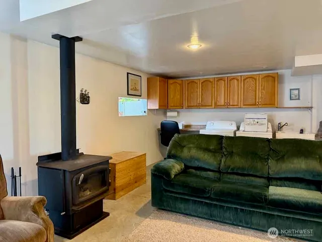 a kitchen with a sink cabinets and window