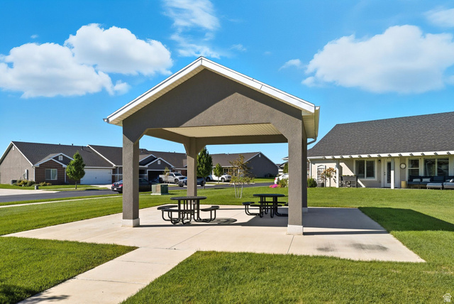 1278 South Grace Way Layton, UT 84041 - Photo 21 of 23 Central open-air pavilion featuring a gabled roof, concrete pad, and two picnic tables