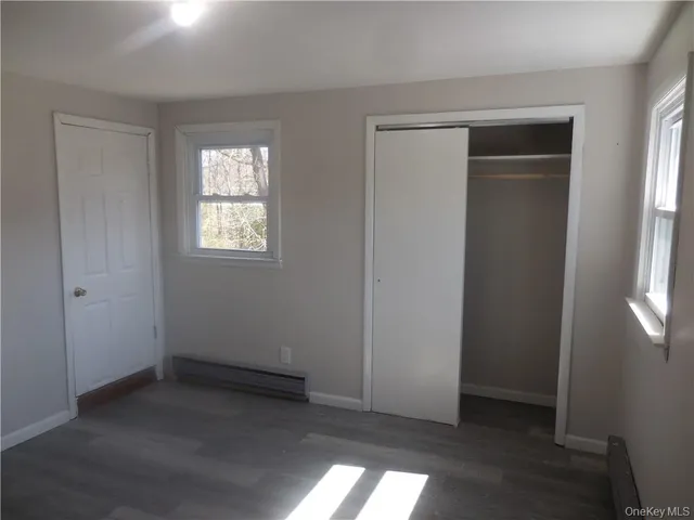 a view of empty room with windows