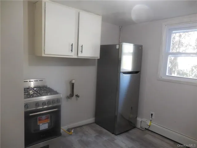 a kitchen with a stove and a microwave