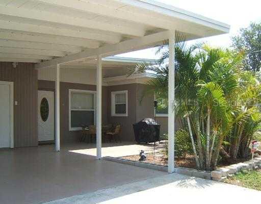 2921 Novus Street Sarasota, FL 34237 - Photo 1 of 1 a view of a entryway door front of house