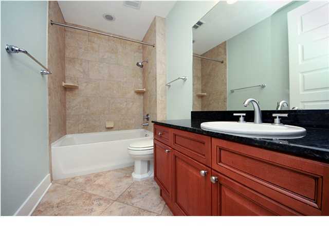 211 Durango Road, Unit 517 Destin, FL 32541 - Photo 16 of 28 a bathroom with a sink a toilet and shower