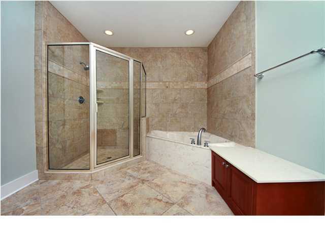 211 Durango Road, Unit 517 Destin, FL 32541 - Photo 9 of 28 a bathroom with a tub sink shower and a mirror