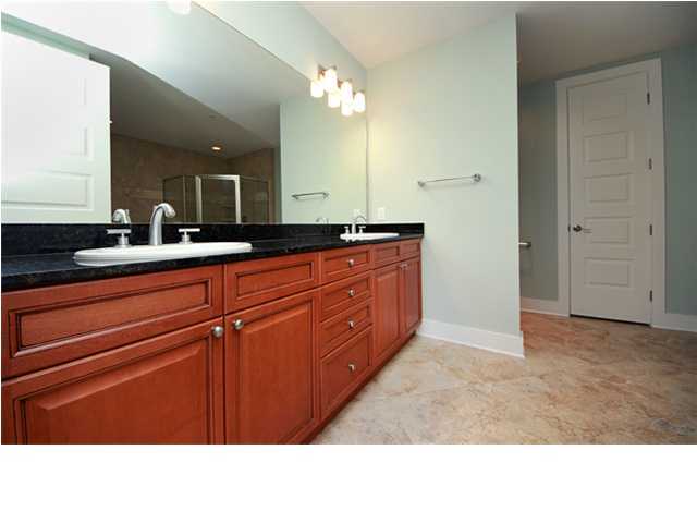 211 Durango Road, Unit 517 Destin, FL 32541 - Photo 10 of 28 a bathroom with a sink a mirror and a vanity