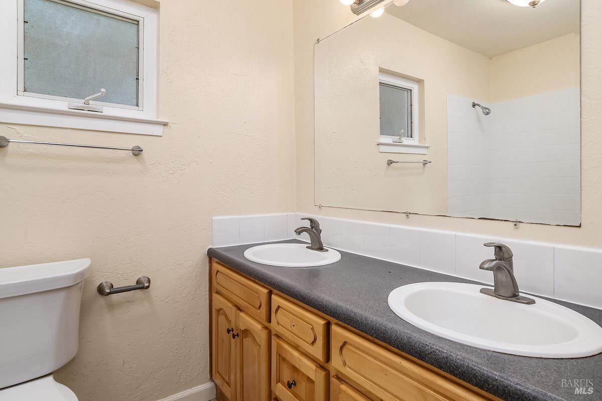 1135 4th Street Novato, CA 94945 - Photo 35 of 47 ADU bathroom with shower over tub and 2 sinks