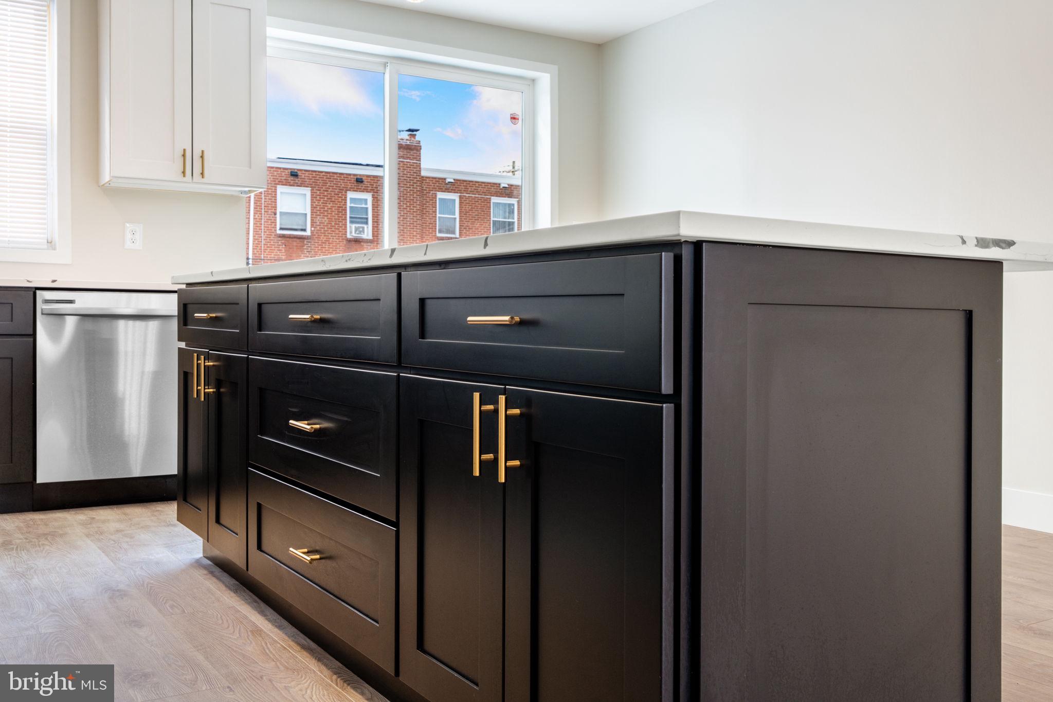 8546 Forrest Avenue Philadelphia, PA 19150 - Photo 17 of 56 a kitchen with a refrigerator and cabinets