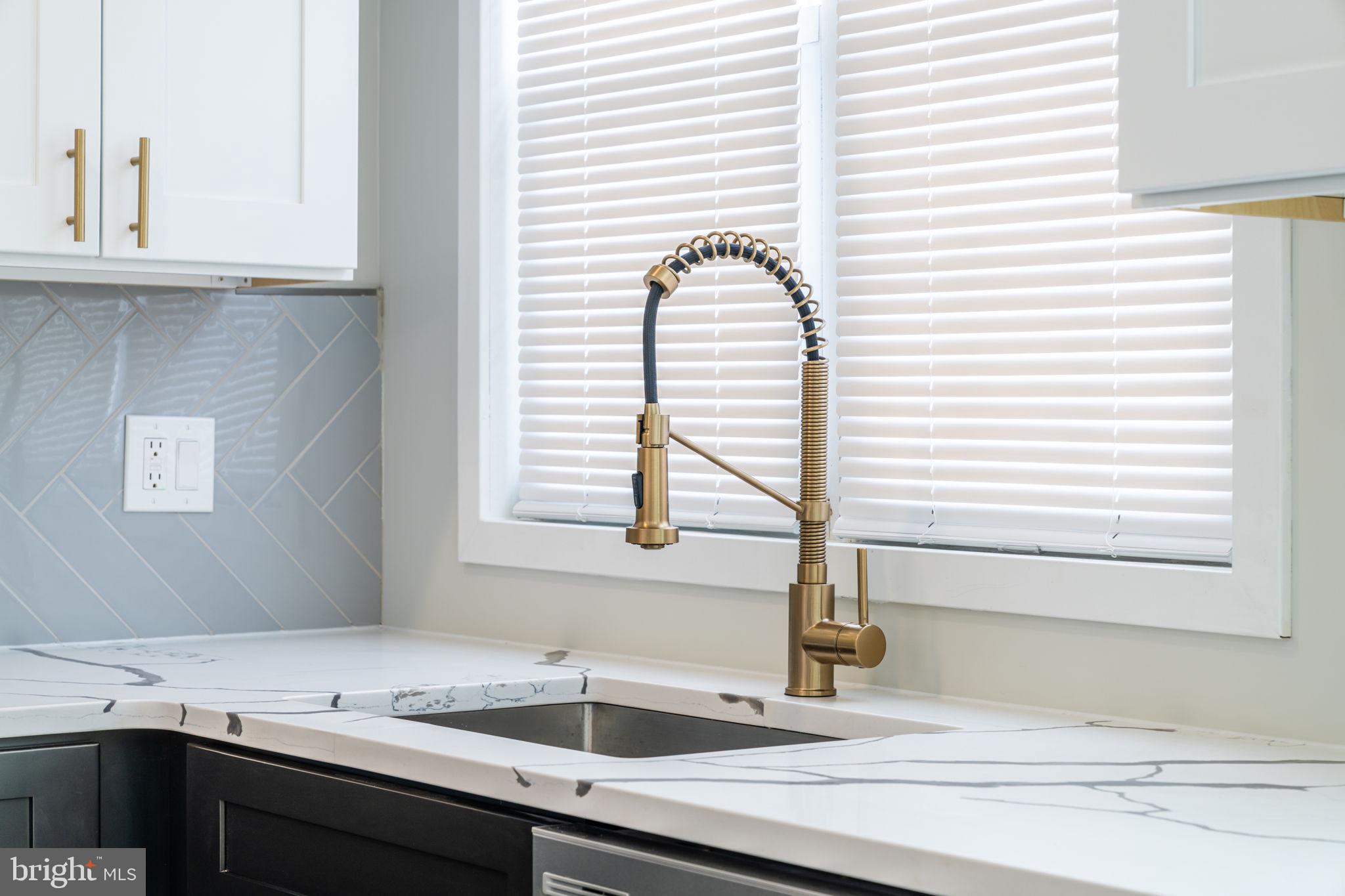 8546 Forrest Avenue Philadelphia, PA 19150 - Photo 18 of 56 a kitchen with a sink cabinets and a window