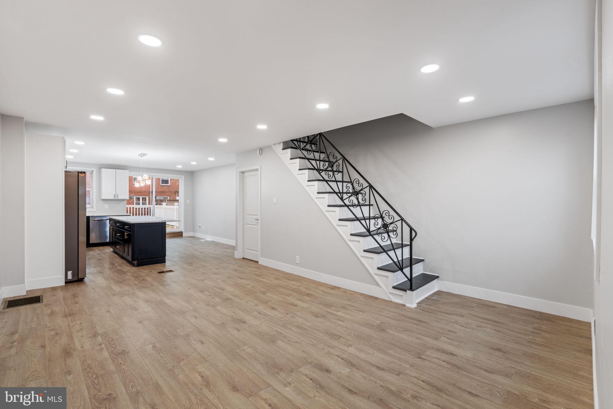 8546 Forrest Avenue Philadelphia, PA 19150 - Photo 19 of 56 a view of a room with wooden floor windows and stairs