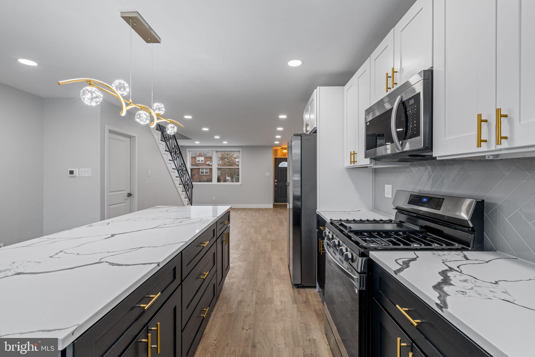 8546 Forrest Avenue Philadelphia, PA 19150 - Photo 2 of 56 a kitchen with a stove and a sink