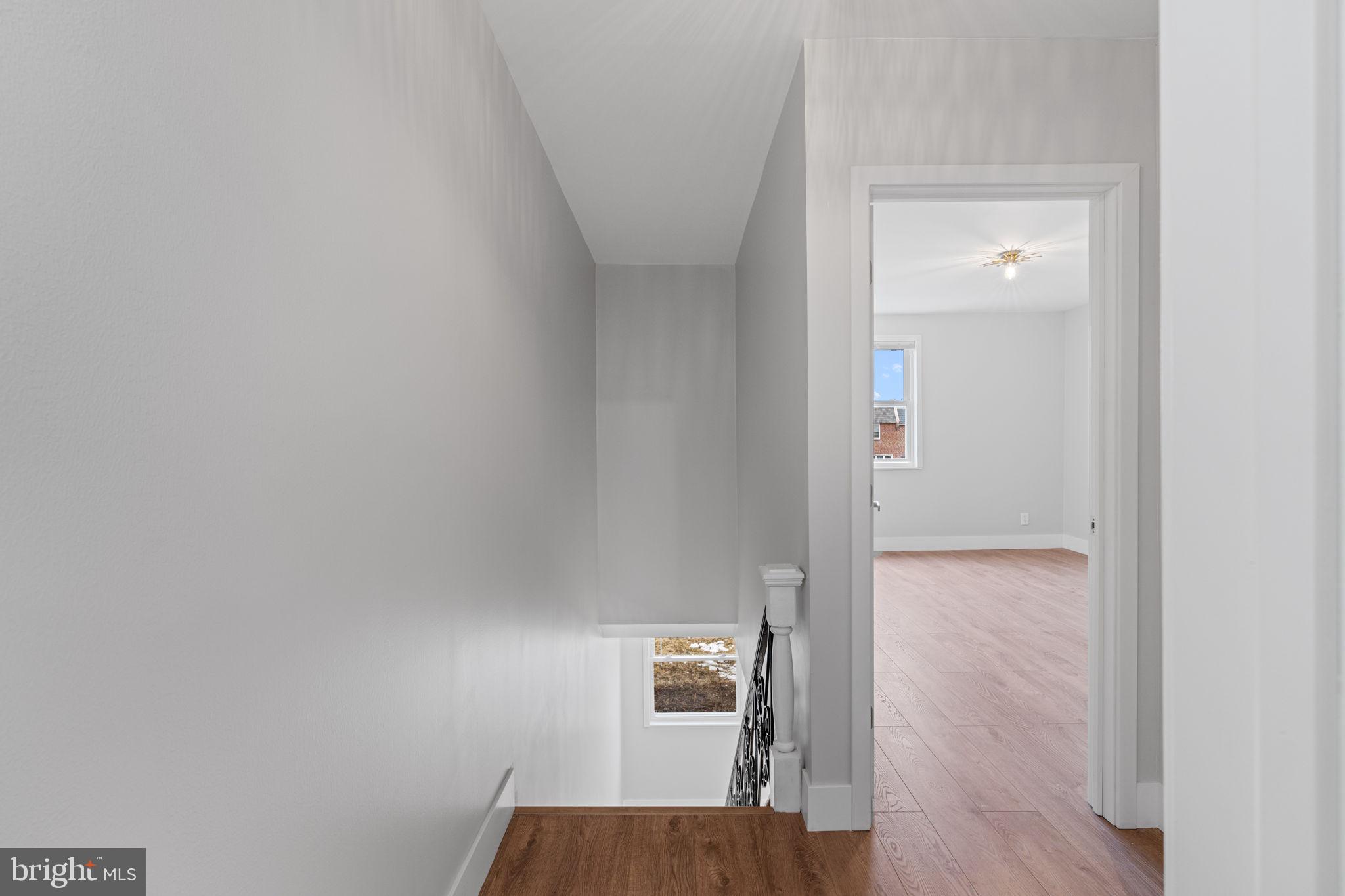 8546 Forrest Avenue Philadelphia, PA 19150 - Photo 25 of 56 a view of a hallway with wooden floor