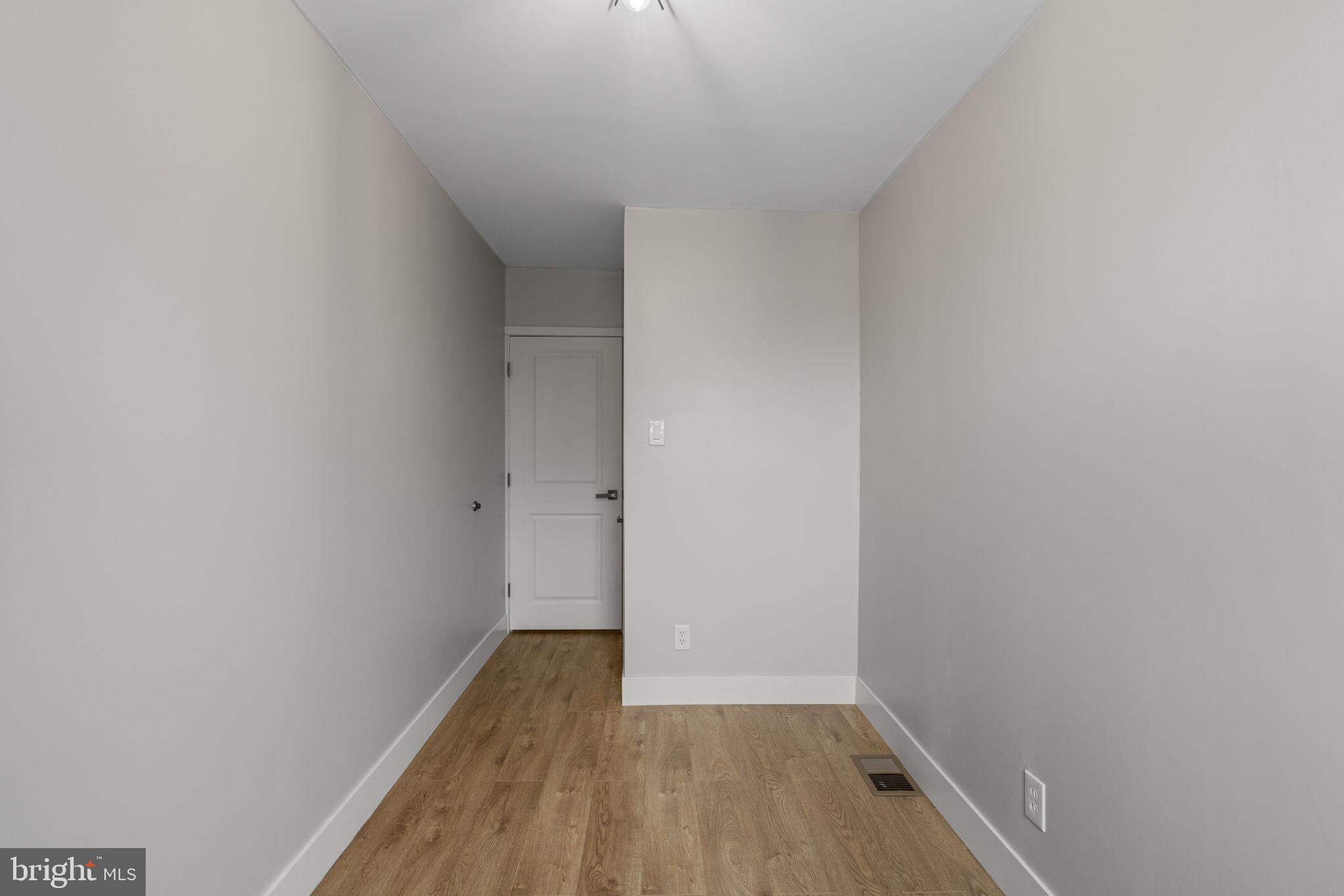 8546 Forrest Avenue Philadelphia, PA 19150 - Photo 39 of 56 a view of a small space with wooden floor and a window