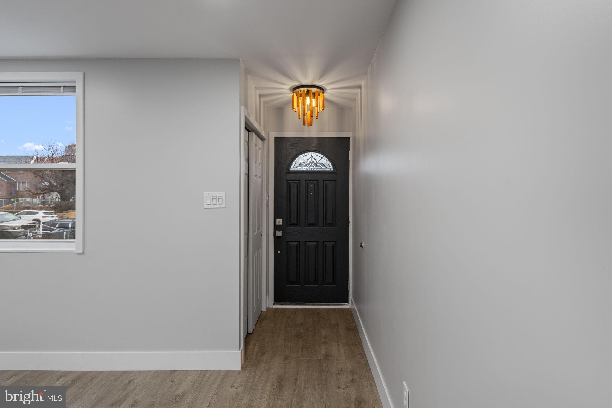 8546 Forrest Avenue Philadelphia, PA 19150 - Photo 4 of 56 a view of a hallway with wooden floor
