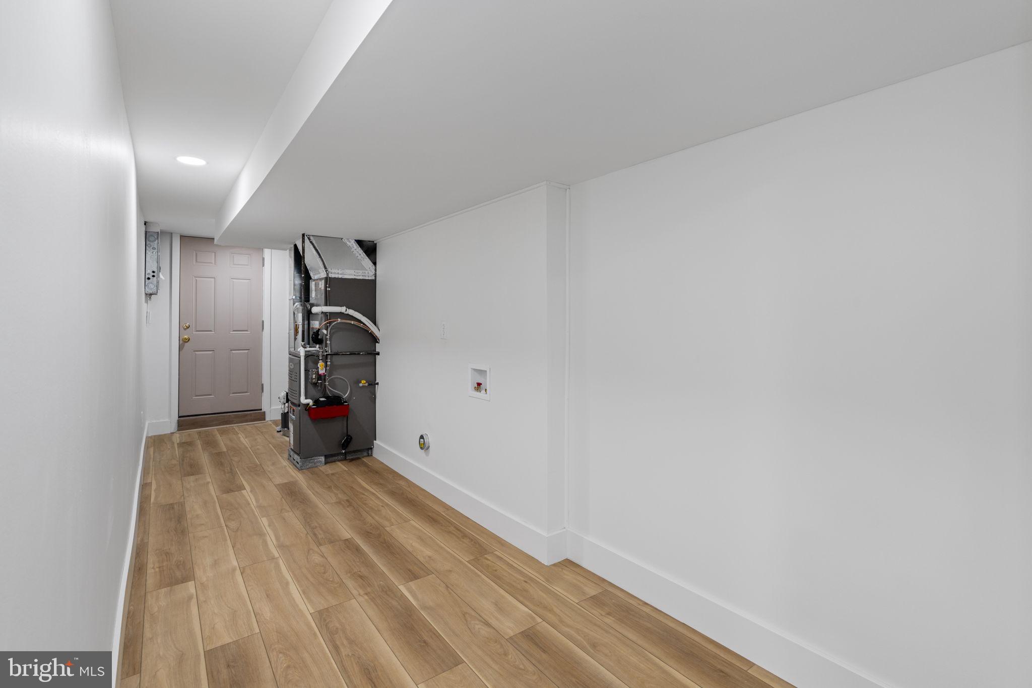 8546 Forrest Avenue Philadelphia, PA 19150 - Photo 42 of 56 a view of empty room with a fireplace