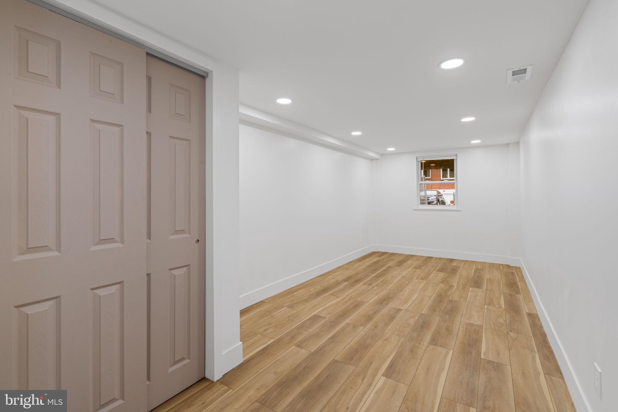 8546 Forrest Avenue Philadelphia, PA 19150 - Photo 43 of 56 a view of empty room with wooden floor