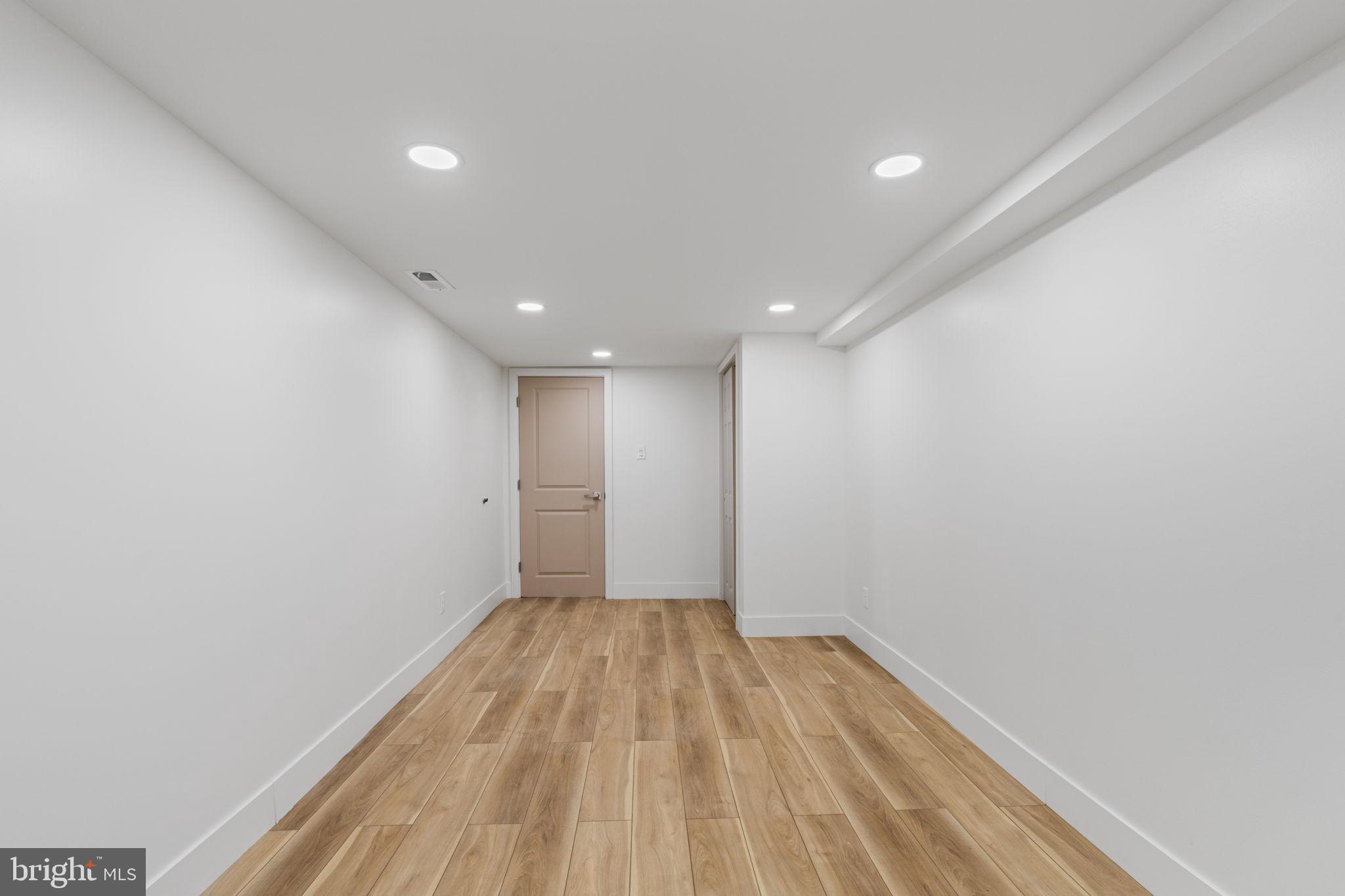 8546 Forrest Avenue Philadelphia, PA 19150 - Photo 44 of 56 a view of empty room with wooden floor