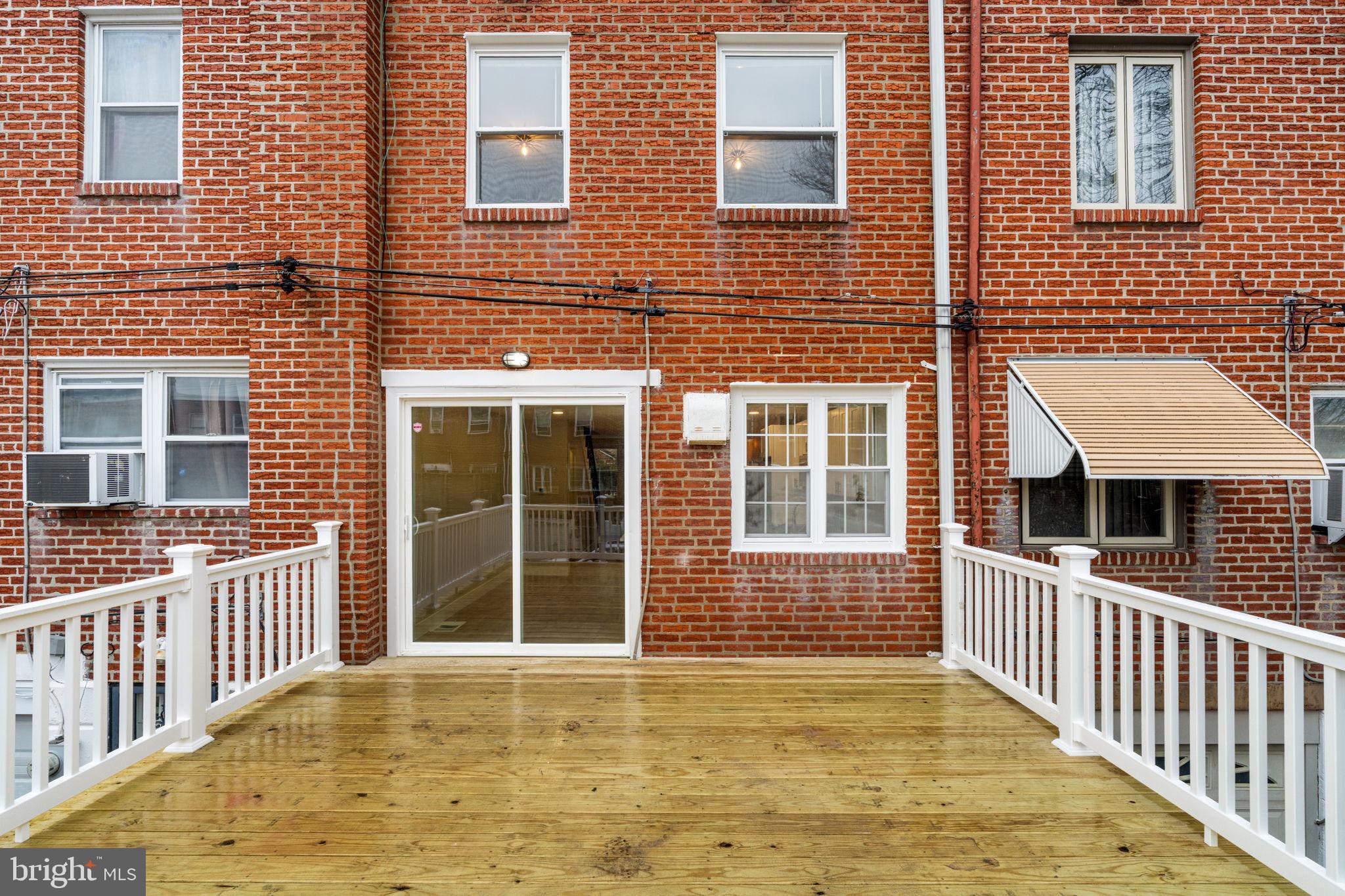 8546 Forrest Avenue Philadelphia, PA 19150 - Photo 54 of 56 a view of a brick house with many windows