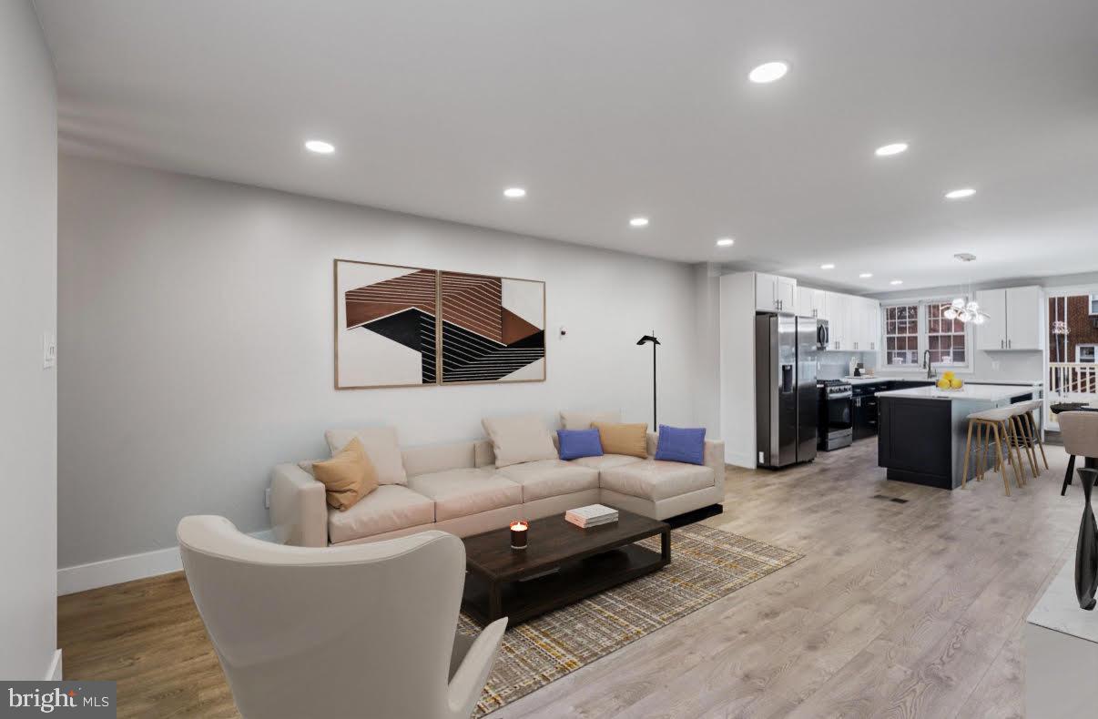 8546 Forrest Avenue Philadelphia, PA 19150 - Photo 8 of 56 a living room with furniture and view of kitchen
