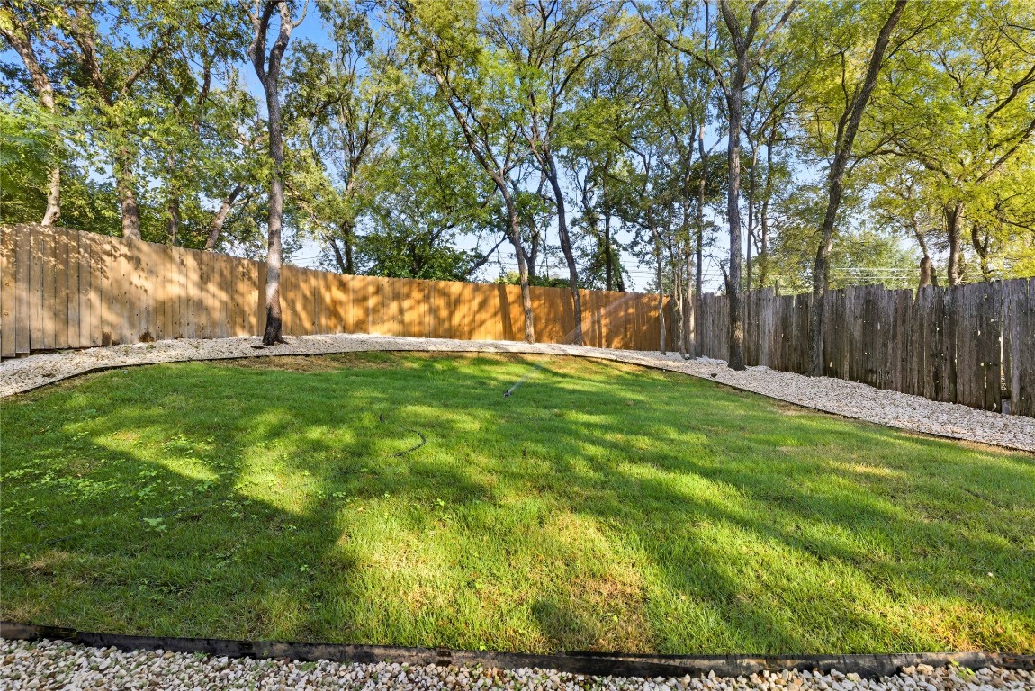 5401 Agua Caliente Cove, Unit B Austin, TX 78744 - Photo 24 of 26 a view of yard with trees