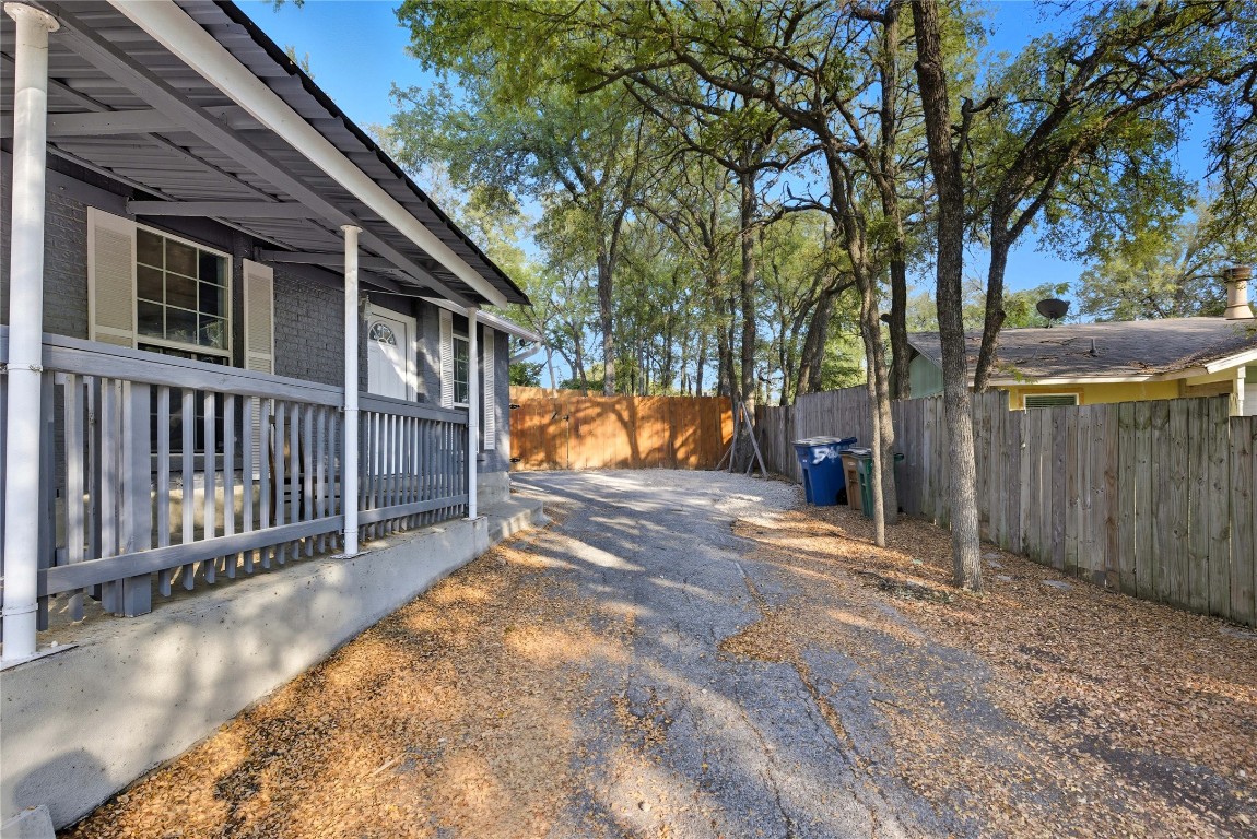 5401 Agua Caliente Cove, Unit B Austin, TX 78744 - Photo 3 of 26 a view of a house with a snow on the road