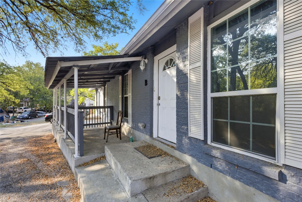 5401 Agua Caliente Cove, Unit B Austin, TX 78744 - Photo 4 of 26 a porch with seating space and garden view