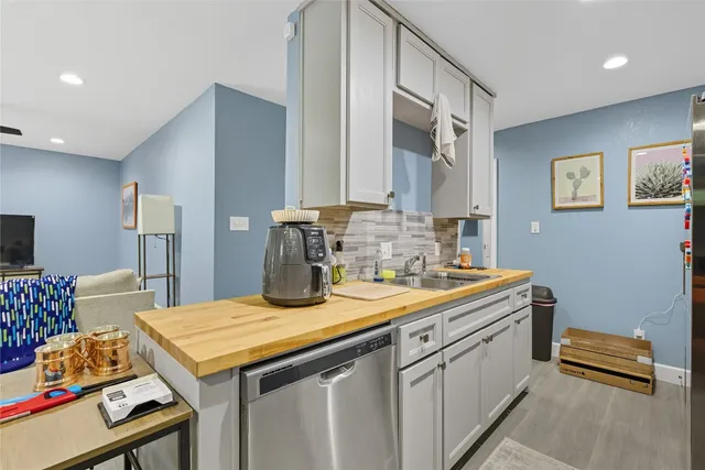a kitchen with a sink and cabinets