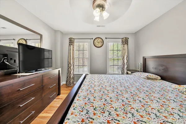 a room with pool table and windows