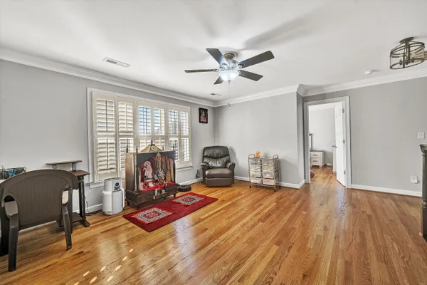 a dining room with a table and chairs