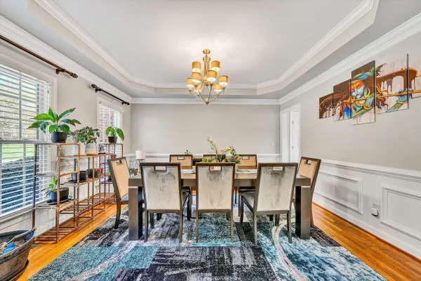 a view of a dining room with furniture window and wooden floor