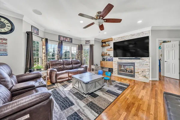 a living room with furniture and a flat screen tv